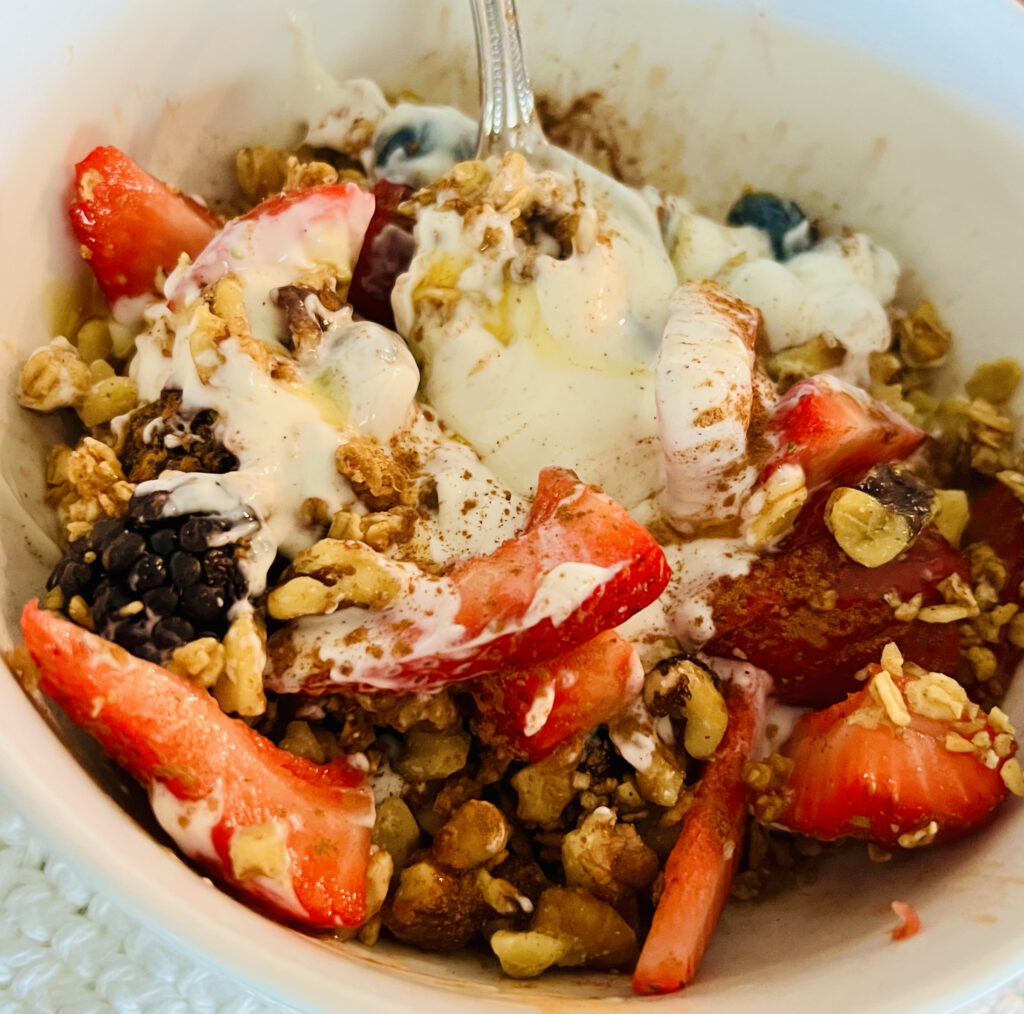 bowl of yogurt parfait with granola and fruit