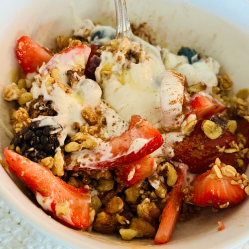 bowl of yogurt parfait with granola and fruit